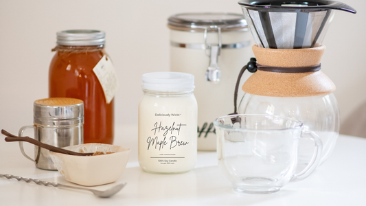 Deliciously Wickt Hazelnut Maple Brew 16 oz mason jar soy candle styled with a pour-over coffee setup and honey jar.