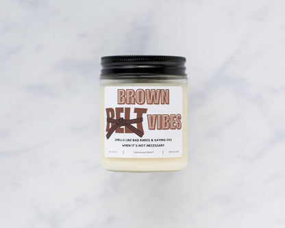 Brown Belt Vibes Jiu-Jitsu soy candle on a marble background