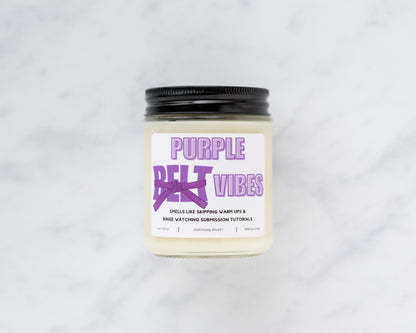 Purple Belt Vibes Jiu-Jitsu soy candle on a marble background