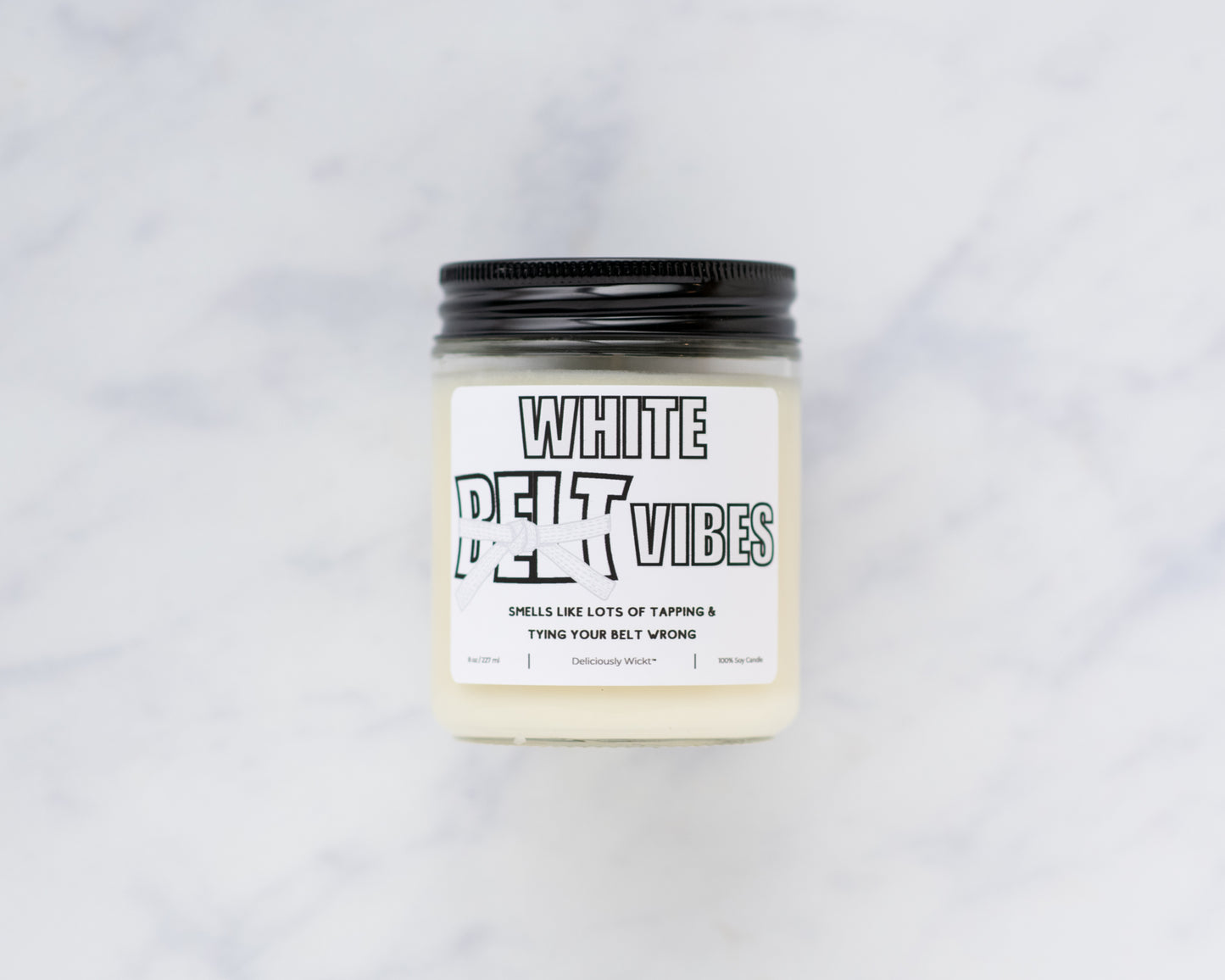 White Belt Vibes Jiu-Jitsu soy candle on a marble background