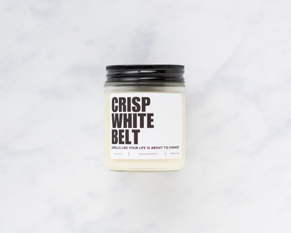 Crisp White Belt Jiu-Jitsu soy candle displayed on a marble background
