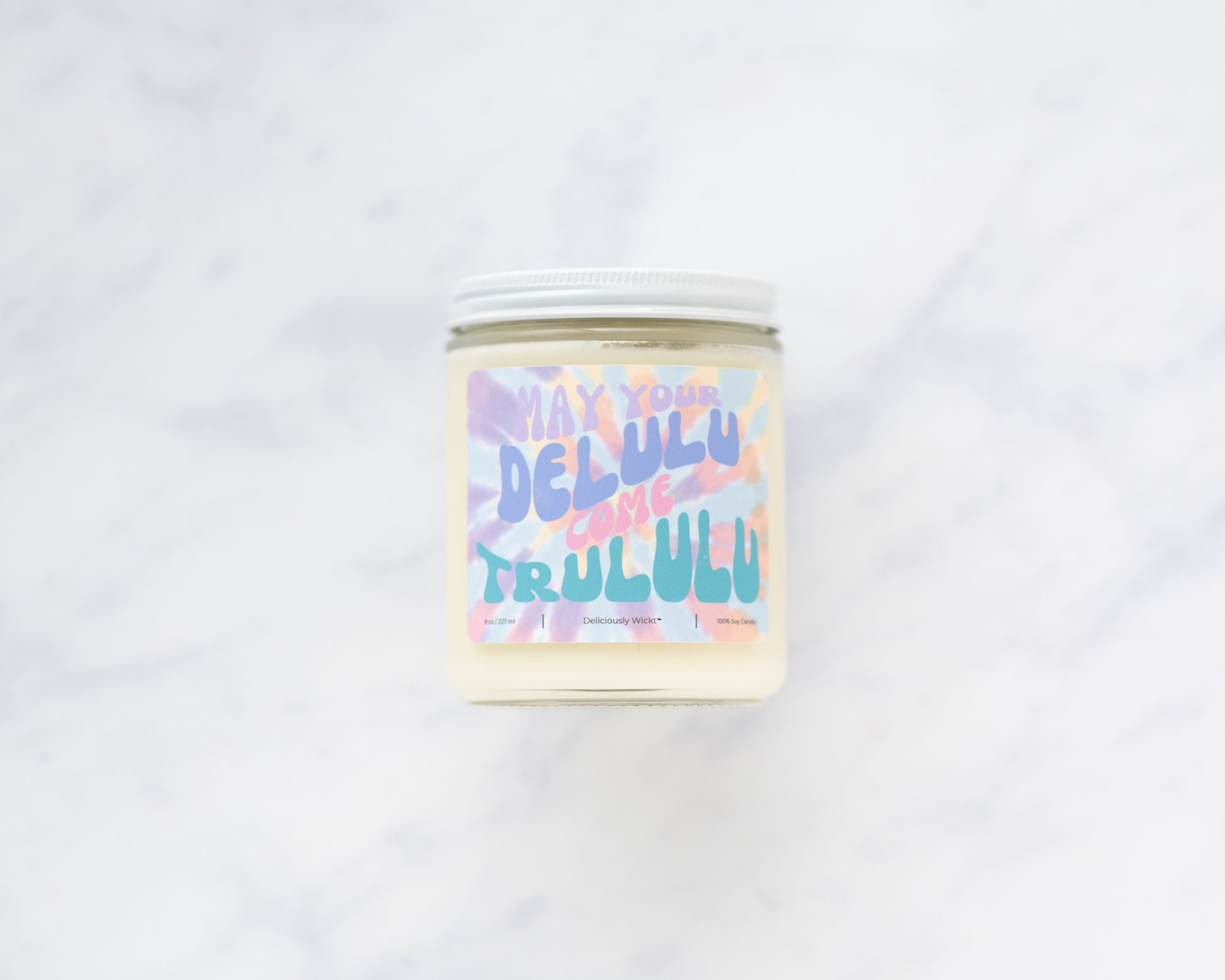 Deliciously Wickt Delulu Come Trululu 8 oz soy candle displayed against a light neutral background.