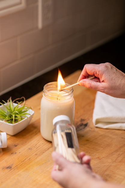 Deliciously Wickt long stick safety match being used to light a soy candle.