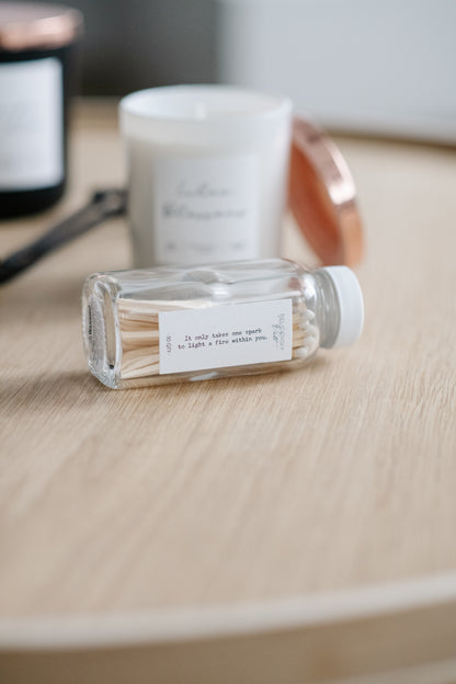 Deliciously Wickt mystery candle bundle products displayed together on a wooden surface.